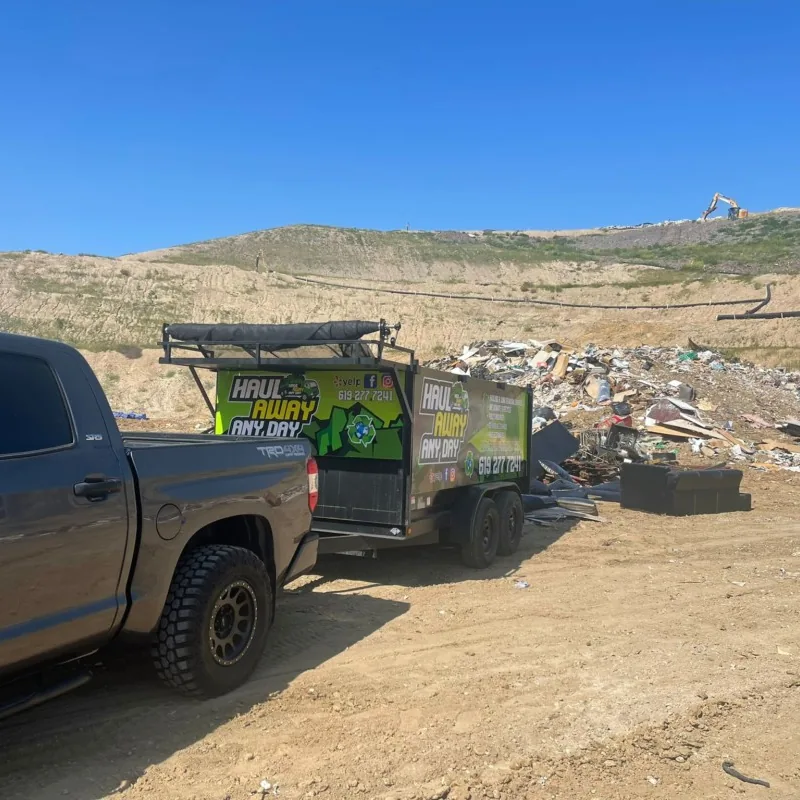 Haul Away Any Day trailer unloading at the disposal site
