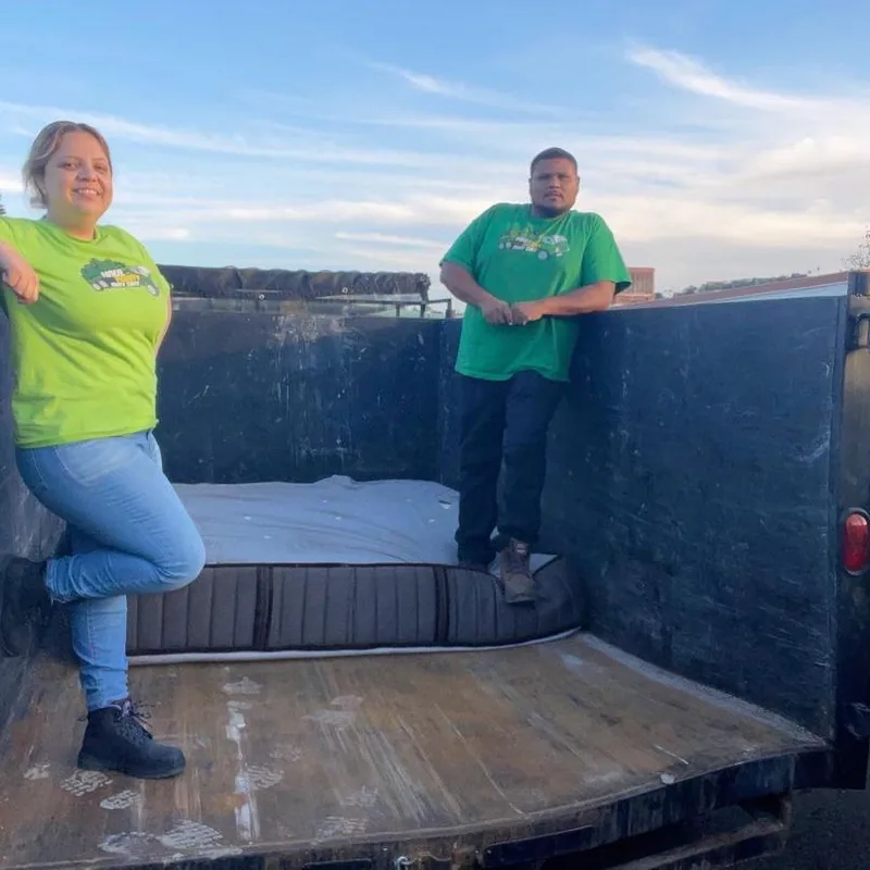 Team inside the emptied trailer after a drop-off