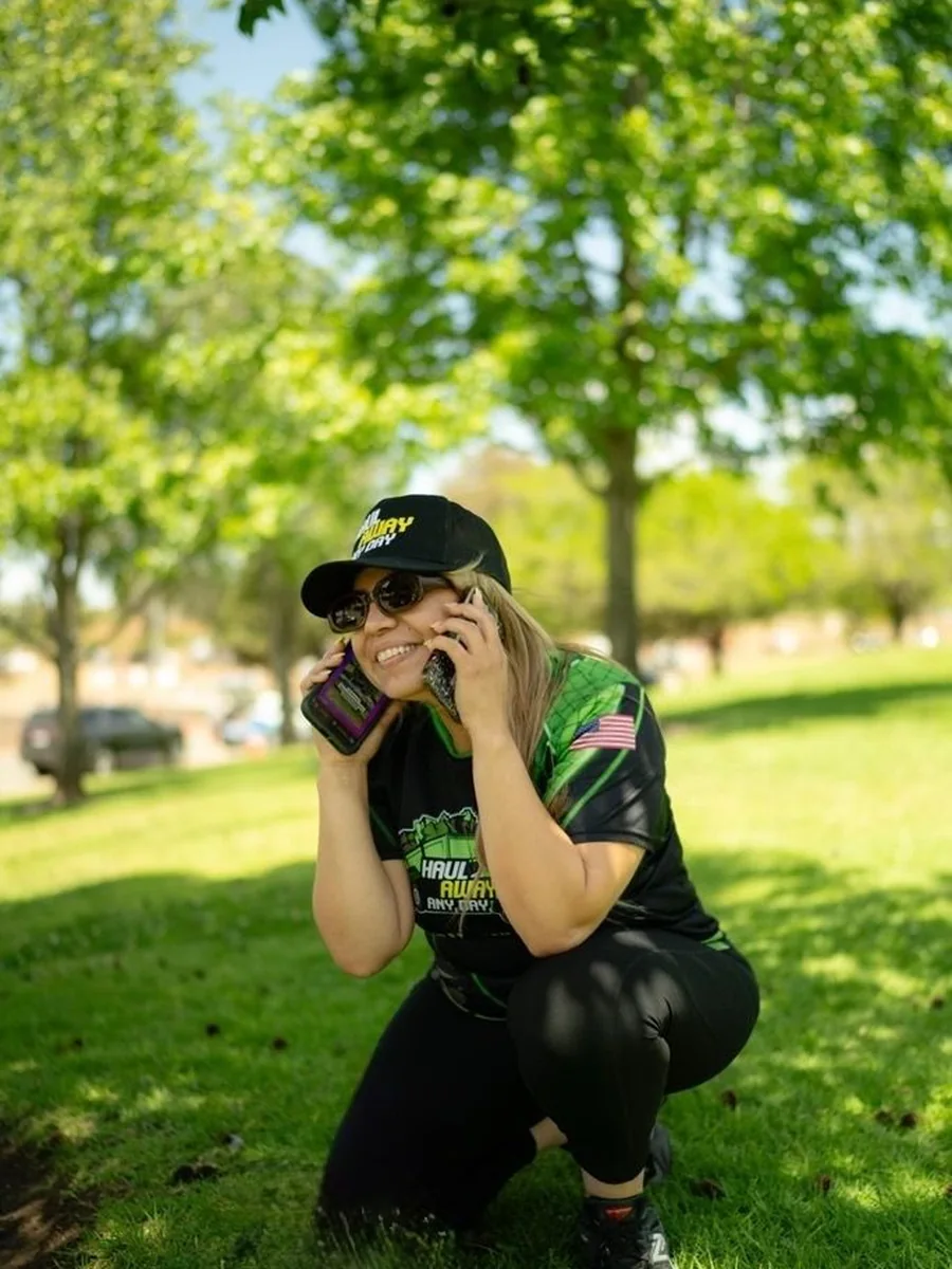 Haul Away Any Day team member taking customer calls